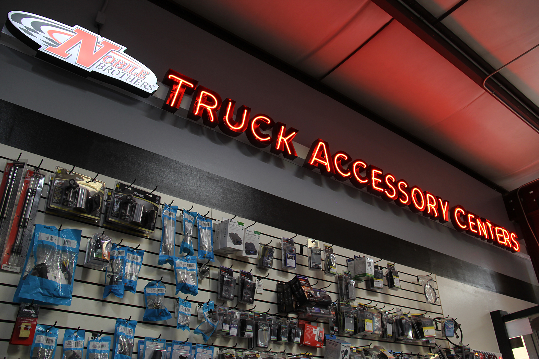 A shelf containing truck parts, inside Nobile Brothers Truck Accessories.