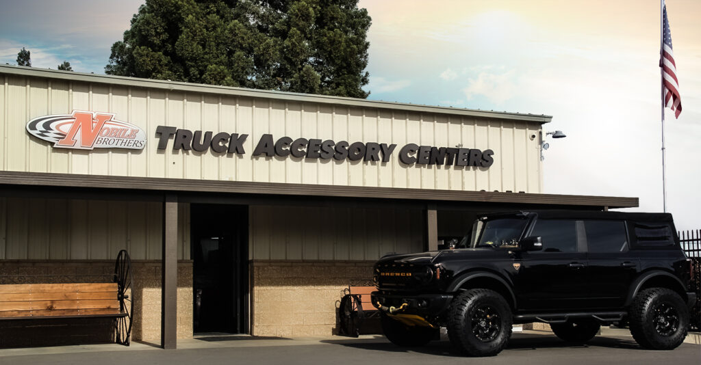 The storefront of a truck parts store, named Nobile Truck Accessory Centers, located in Sunnyside Fresno.