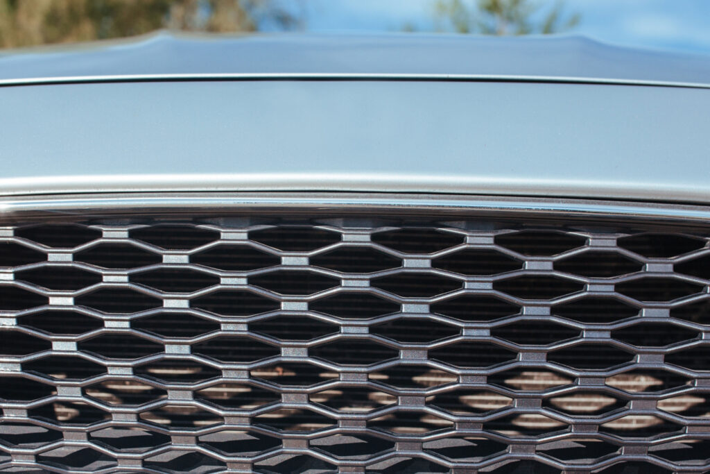 A custom billet grille on a truck, by T REX Grilles.