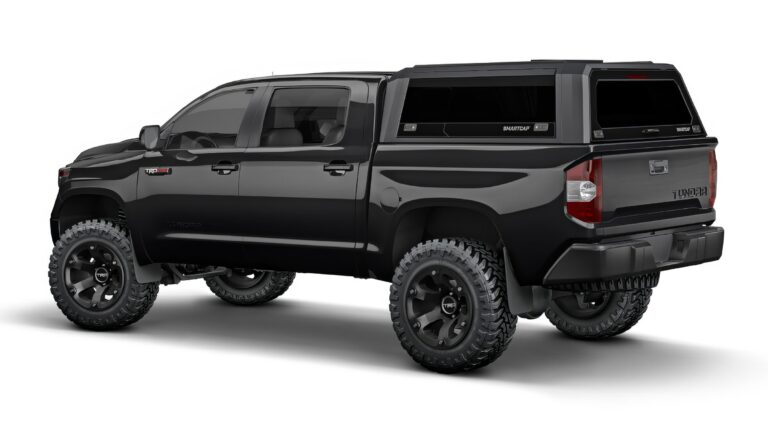 A black Toyota Tundra with a camper shell