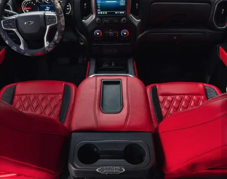 A custom red leather interior in a Chevrolet truck, upgraded by a Katzkin installer.