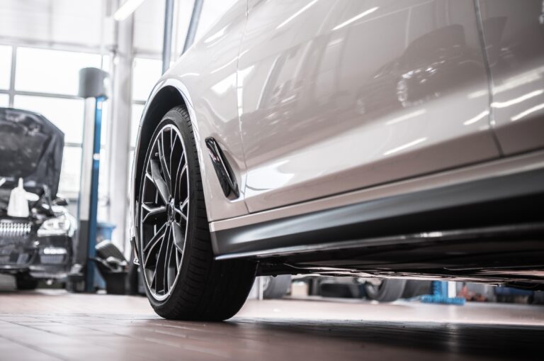 A rocker panel on a vehicle, inside a building.