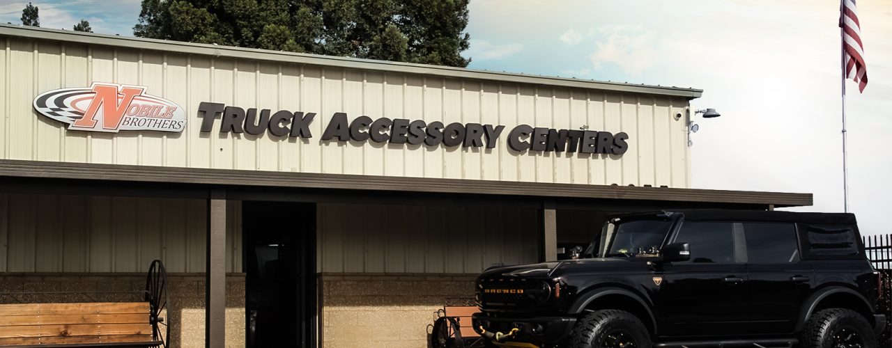 The storefront of a truck parts store, named Nobile Truck Accessory Centers, located in Sunnyside Fresno.